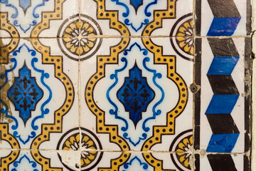 Close up on traditional portuguese Azulejos, ceramic tiles on the facade of a house in Lisbon Portugal
