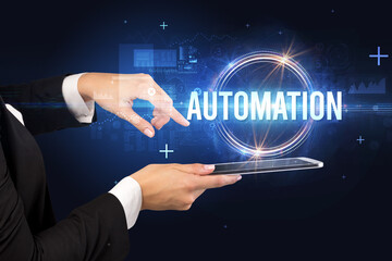 Obraz premium Close-up of a touchscreen with AUTOMATION inscription, new technology concept