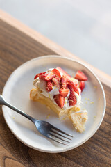 Strawberry Cheesecake with Whipped Cream and Lemon Zest