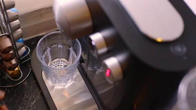 Espresso being made with a coffee pods machine