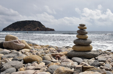 a tower of stones on the beach