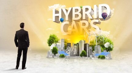 Rear view of a businessman standing in front of HYBRID CARS inscription, Environmental protection concept