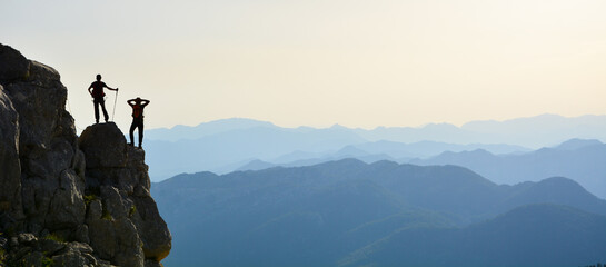 Silhouette of a man on the top of the mountain