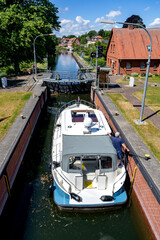 motorboat in the river Elde lock in Plau am See, Germany