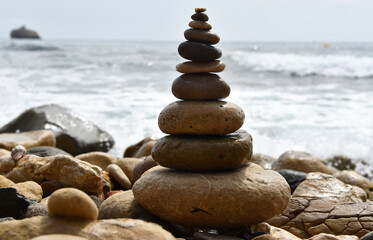 a tower of stones on the beach