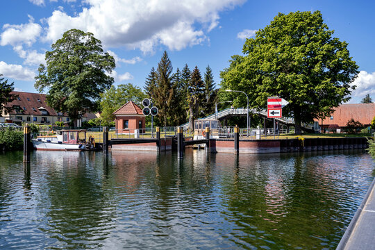 river Elde lock with the so called H&uuml;hnerleiter (chicken ladder) footbridge in Plau am See, Germany