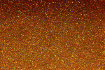 Luxury gold glitter texture with bright sparkles and flickers on the white isolated background. Shiny glamour background