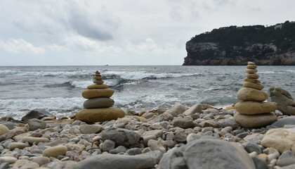 a tower of stones on the beach