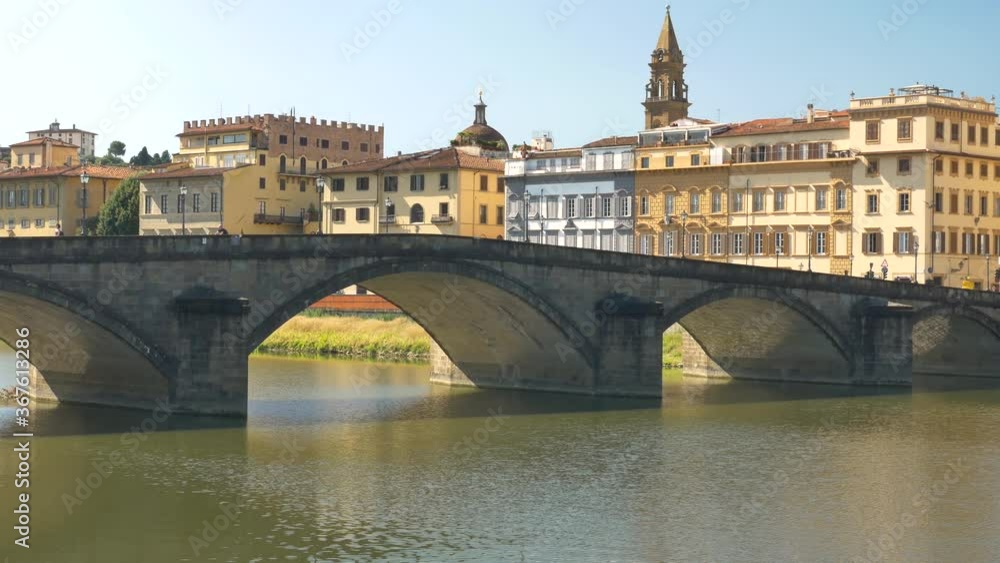 Wall mural a bridge (ponte alla carraia) over the arno river, in a summer morning.