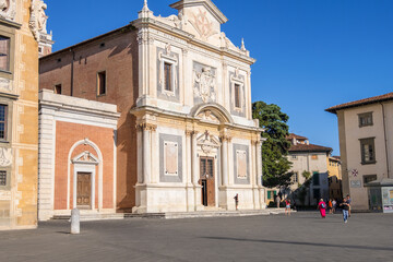 Pisa, Italy - August 14, 2019: Santo Stefano dei Cavalieri church on Piazza dei Cavalieri or Knight's Square in Pisa, Tuscany, Italy