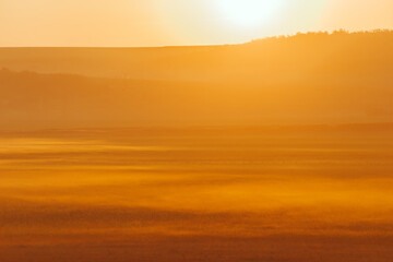 Amazing photo of foggy golden morning at sunrise, beautiful and warm landscape.