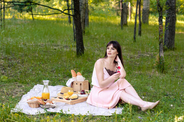 Smiling woman having a relaxing lunch break outdoors