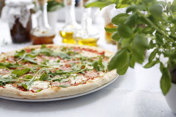 Pizza with ripening ham and arugula.
Traditional Italian pizza. Suggestion to serve a dish. Food background.