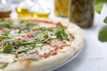Pizza with ripening ham and arugula.
Traditional Italian pizza. Suggestion to serve a dish. Food background.