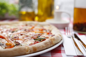 
Italian pizza with grilled vegetables. Traditional Italian pizza. Suggestion to serve a dish. Food background.