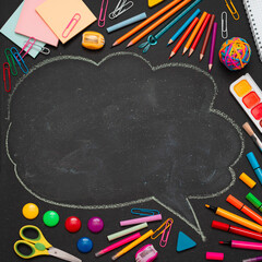 School multi-colored supplies, pencils and a drawn cloud with copy space for text.