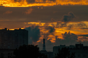 Fototapeta premium sunset over the city with storm clouds