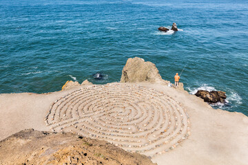 Labyrinth with lonely fisherman in San Francisco secret spot.