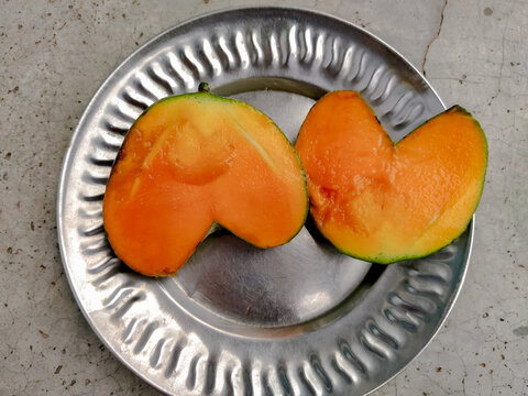 Ripe mango Fruit isolated on the pot