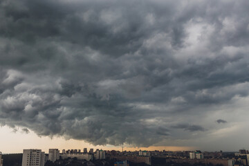 Before heavy rain storm. On the sky is covered all over by the clouds. A lot of lightning and...