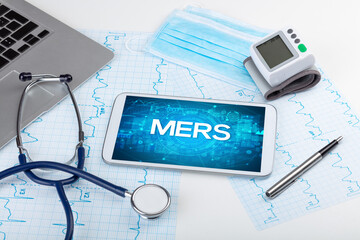 Close-up view of a tablet pc with MERS abbreviation, medical concept
