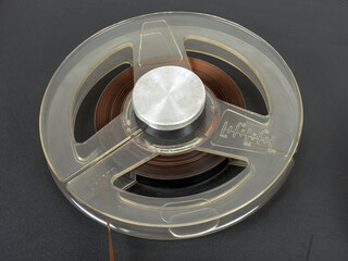 Reel of old audio tape in tape recorder
