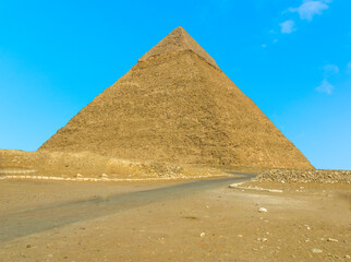 The Great Pyramid at Giza, Egypt stands out from a blue sky in summer