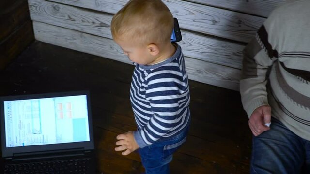 business baby with a laptop and mobile phone. business comcept