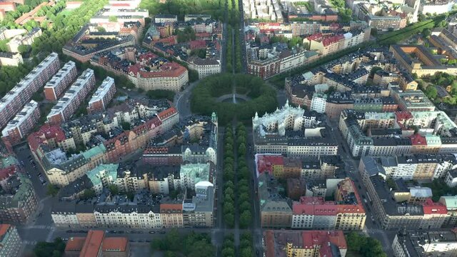Aerial of the Karlaplan Park, Square and Fountain, in the capital city of Stockholm, Sweden. Flying over the district.