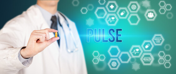 Close-up of a doctor giving you a pill with PULSE inscription, medical concept