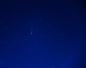 Fototapeta na wymiar neowise comet in night blue clear sky with stars