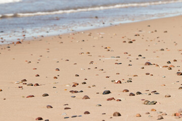Pebbles on a sandy beach

