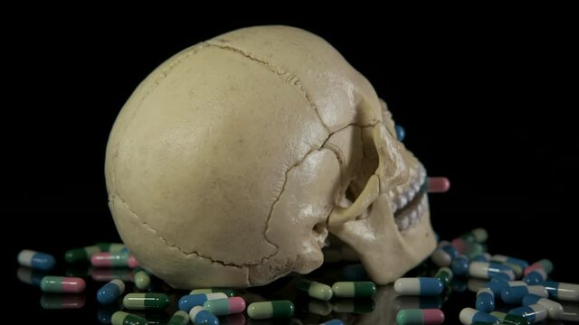 Skull with pills. Skull with pills. Death from overdose of pills.