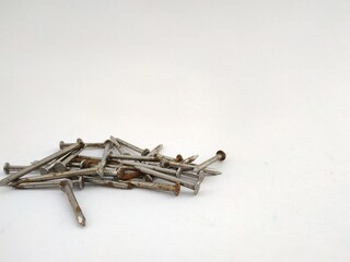 different views of steel nails on a white background