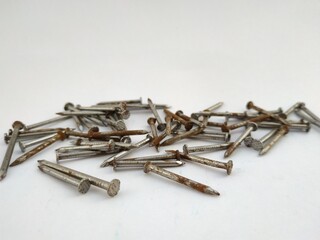 different views of steel nails on a white background