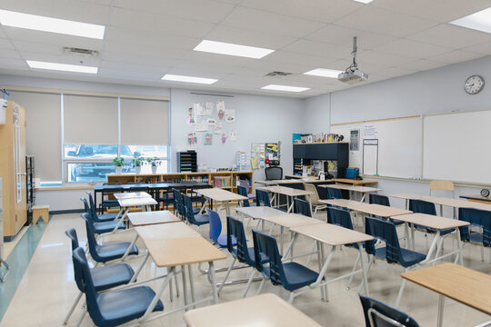 Desks in empty high school classroom