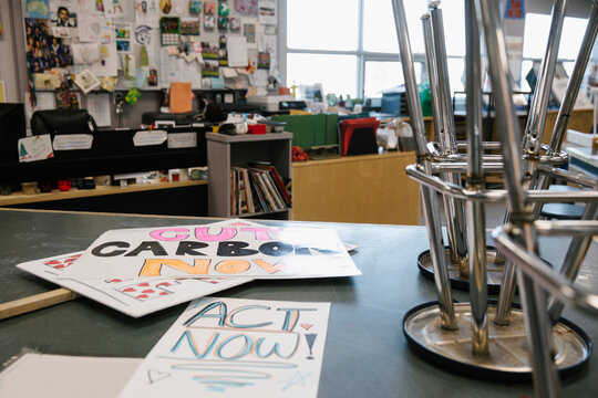 Environmental rally posters on classroom table