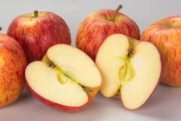 Selected apples and apple slices over white background
