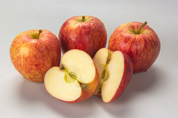 Naklejka na ściany i meble Selected apples and apple slices over white background