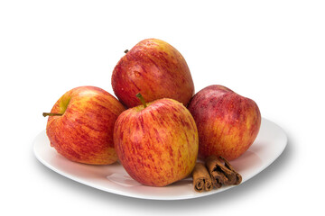 Apple. Slices of apple on the plate with cinnamon in pieces.