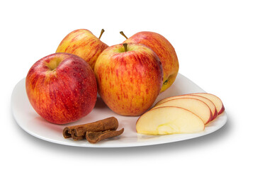 Apple. Slices of apple on the plate with cinnamon in pieces.