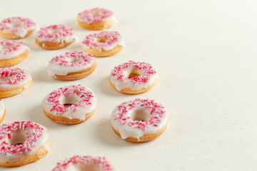 pink donuts with icing sugar
