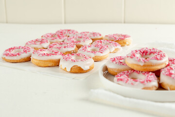 pink and white sugar donuts