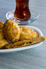Traditional Turkish Deep Fried Dough on blue wooden table with tea