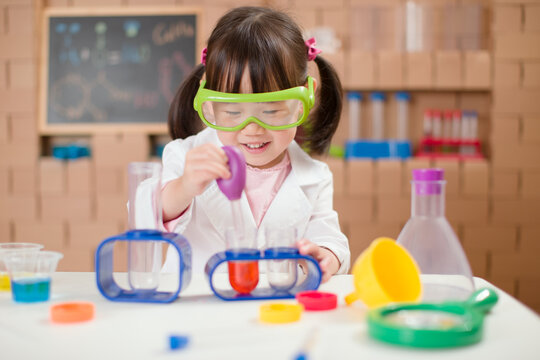 young  girl  play science experiments for homeschooling