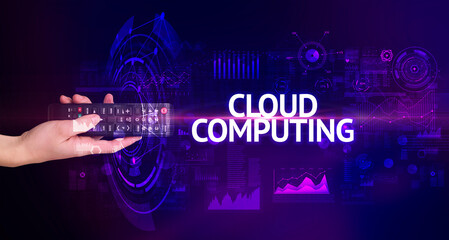 hand holding wireless peripheral with CLOUD COMPUTING inscription, modern technology concept