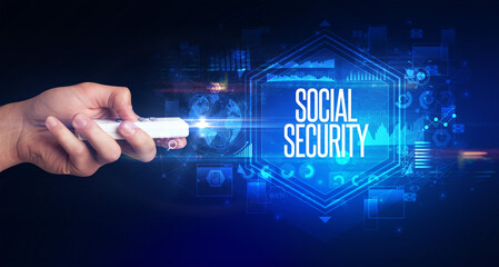 hand holding wireless peripheral with SOCIAL SECURITY inscription, cyber security concept
