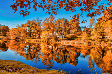 Amazing foliage reflections on a lake. Autumn in New England, USA