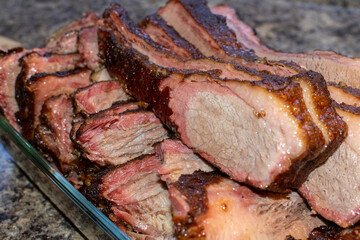 Sliced smoked brisket with smoke ring.