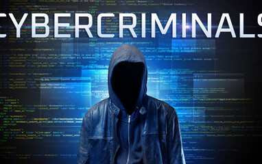 Faceless hacker with CYBERCRIMINALS inscription on a binary code background